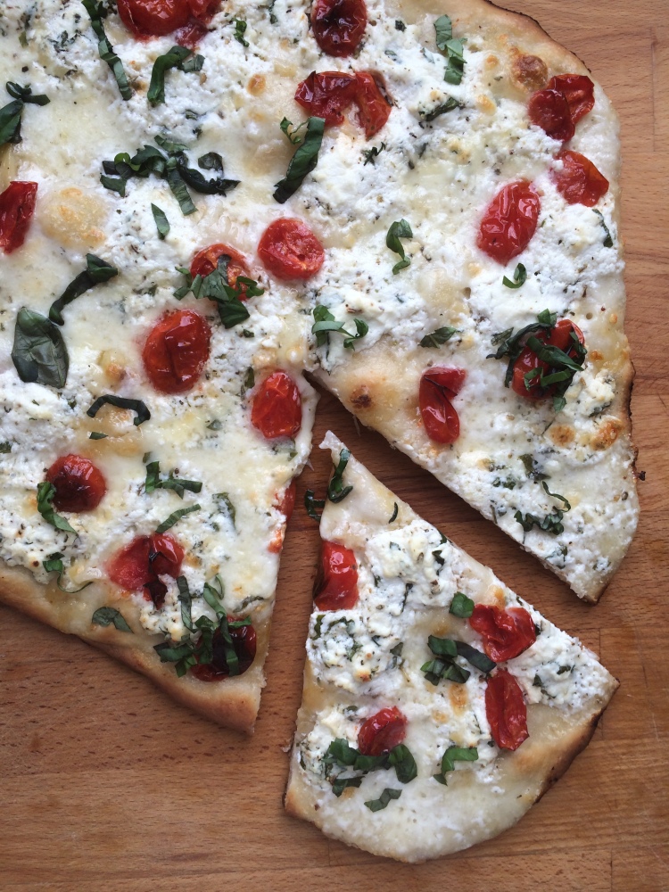 White Pizza with Roasted Garlic, Ricotta, Burrata, and Cherry Tomatoes